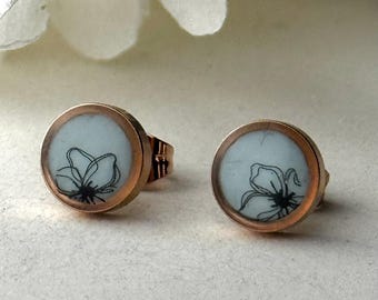 Rose gold-plated stainless steel stud earrings in a delicate blue with a black floral motif – handcrafted, delicate jewelry gift for women