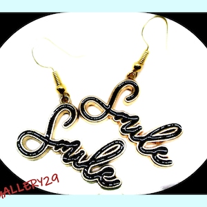 Smile writing charm earrings in black gold background, jewel earrings ready to offer, promo code