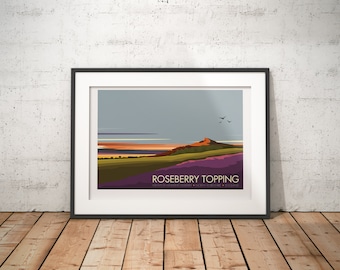 May include: A framed illustration of Roseberry Topping, a hill in North Yorkshire, England. The illustration features a purple and green landscape with a hill in the background. The text "Roseberry Topping" is printed below the image.