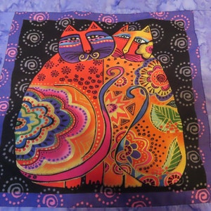 May include: Two colorful cats with intricate patterns and designs on a black background. The cats are facing each other and have bright colors like red, orange, yellow, green, blue, and purple.