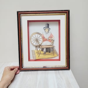Anton Pieck style 3d print Woman & spinning wheel diorama shadow box with glass framed wall hanging picture matted dimensional paper artwork