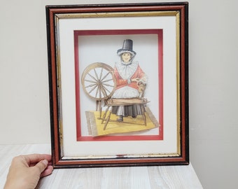 Anton Pieck style 3d print Woman & spinning wheel diorama shadow box with glass framed wall hanging picture matted dimensional paper artwork