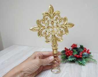 Fleur-de-lis star design coil gold glitter tree topper, vintage spiral top ornament, retro home decor, Christmas bauble plastic cross shaped
