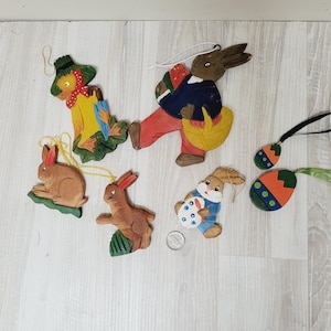 7 adornos colgantes de Pascua planos tallados a mano de Erzgebirge, juego de pato y huevo de conejo de madera vintage hecho a mano en Alemania Huevos de conejo alemanes