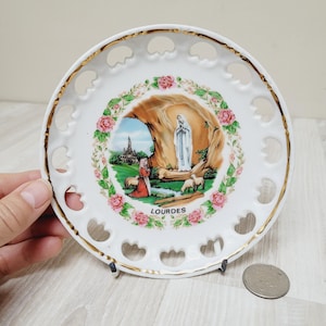 Lourdes French souvenir plate from pilgrimage site, Bernadette Soubirous and Saint Mary print, old catholic icon porcelain lace Wall plaque