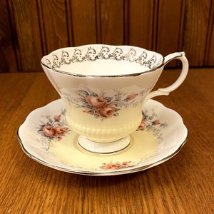 Royal Albert Rose Marie Series, Moonglow Teacup and Saucer in Yellow