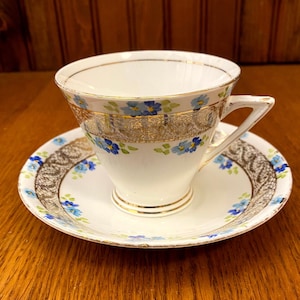 Tasse à thé et soucoupe Phoenix Art déco : motif marguerite peint à la main