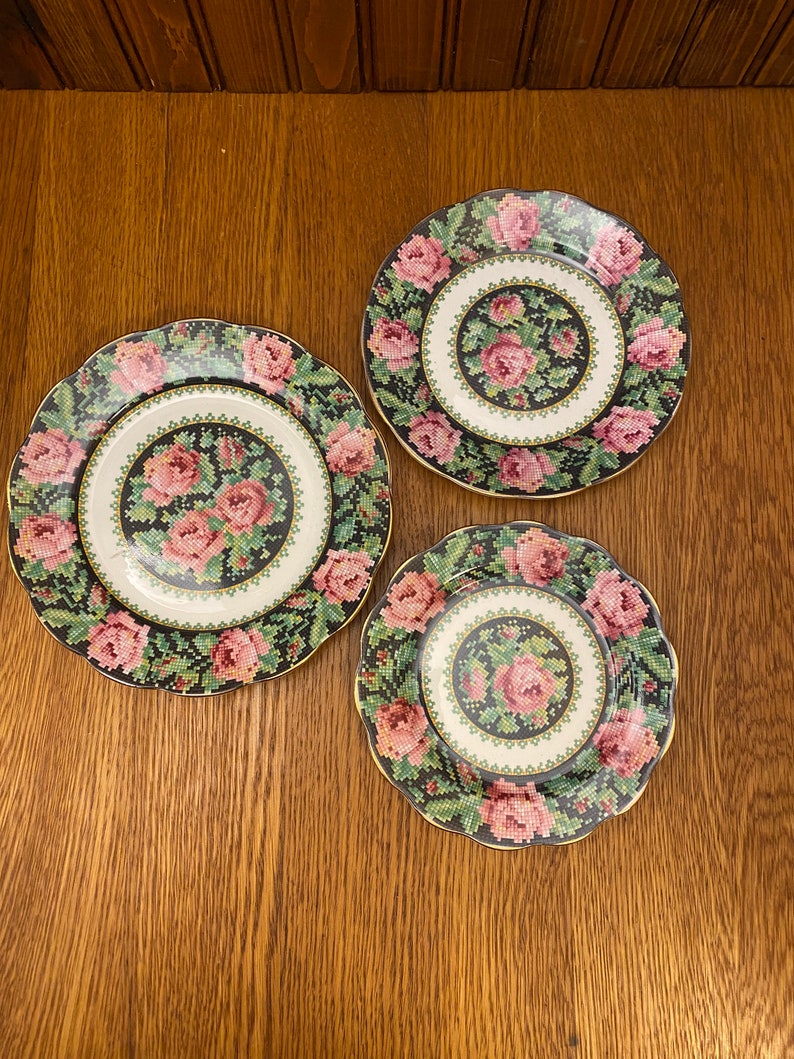 Royal Albert crown china produced this wonderful pattern called Needle Point way back in the 20's.  It looks just like someone hand cross stitched roses on your dinnerware.