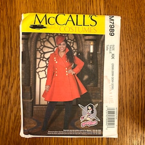 May include: McCall's Costumes sewing pattern for a red coat with gold buttons. The pattern is for sizes KK (26W-28W-30W-32W).