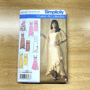 May include: A Simplicity sewing pattern featuring designs from the Khaliah Ali Collection. The pattern includes options for dresses and separates. The size is GG, 26W-32W, with European and French sizes also listed. The cover shows a woman wearing a dress.