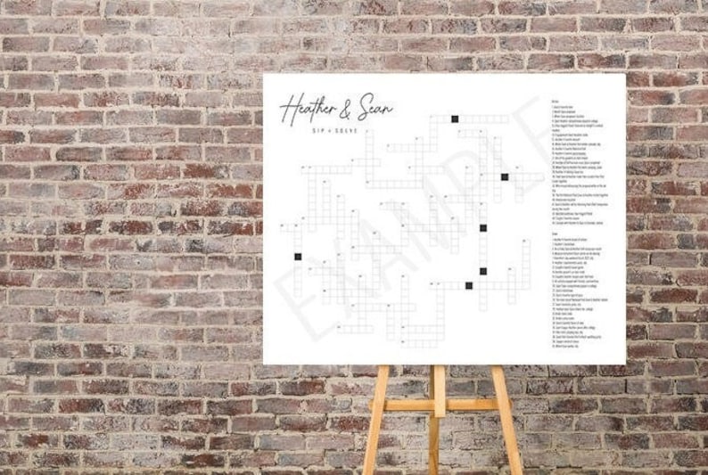 May include: A white poster with a crossword puzzle on it. The poster is titled "Heather & Sean Sip & Solve".