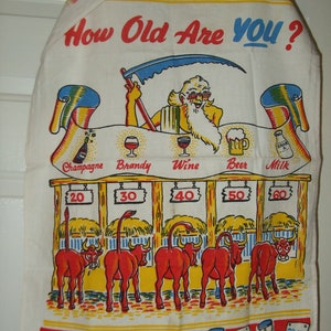 May include: A white tea towel with a colorful illustration of a Grim Reaper holding a scythe and standing in front of a bar with different alcoholic beverages. The text "How Old Are You?" is printed at the top of the towel. The bar has five stalls with the numbers 20, 30, 40, 50, and 60 printed above each stall. There are five red cartoon bulls in each stall. The towel has a red border with hourglass images and the numbers 20-30, 30-40, 40-50, 50-60, and 60-100 printed on them.