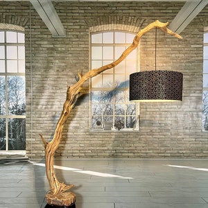 Floor lamp wooden driftwood lamp of decorative oak branch mounted on boulder