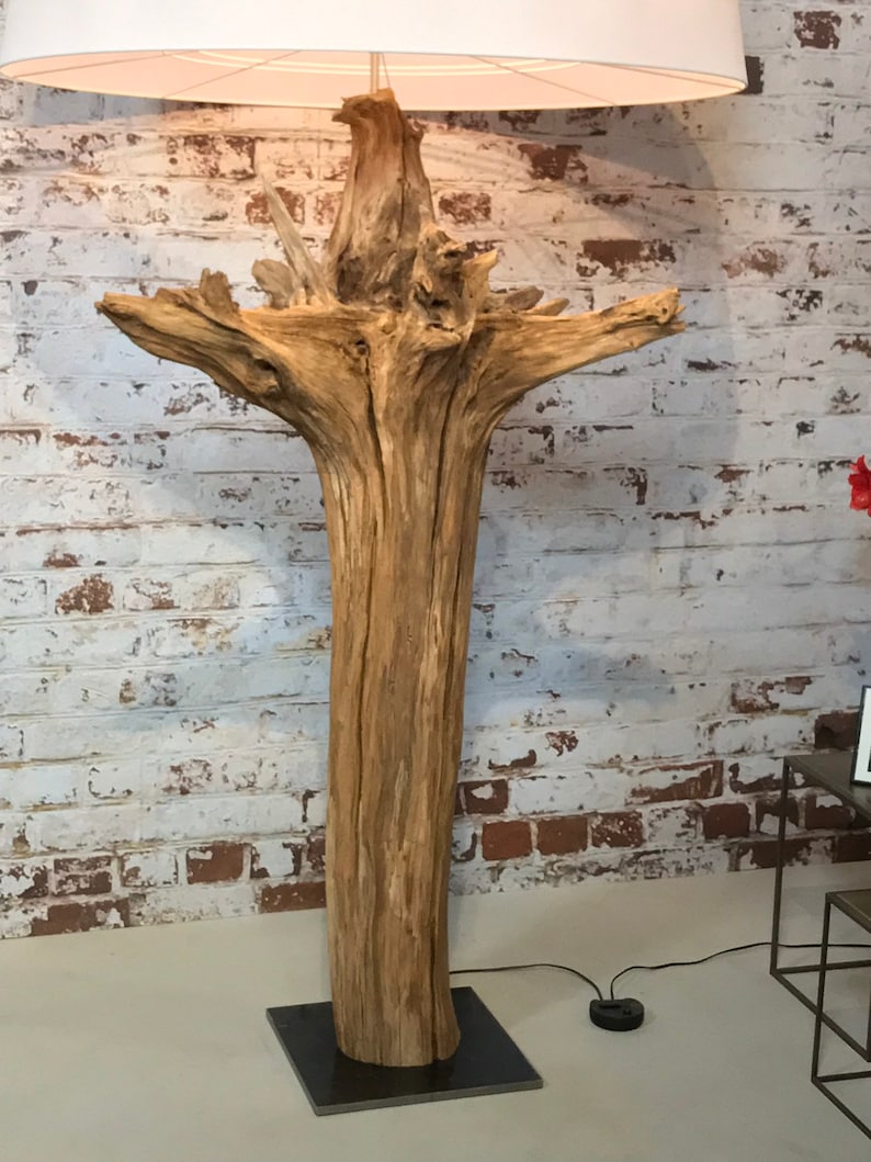 Floor lamp of weathered old tree stump.