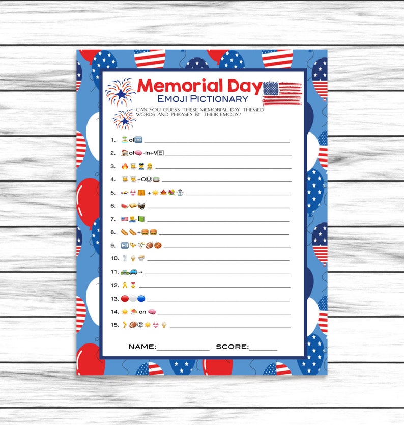May include: A Memorial Day Emoji Pictionary game sheet with a blue background, red and white balloons, and American flags. The sheet has numbered emoji clues to solve, with spaces for answers and a name and score section.