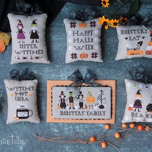 Könnte beinhalten: Ein Set mit 6 Stickkissen-Designs zum Thema Halloween. Die Designs beinhalten "Schwester Hexen", "Hexen-Heißer Kakao", "Frohes Halloween", "Monster-Katze", "Monster-Familie" und "Ich und meine Katze".