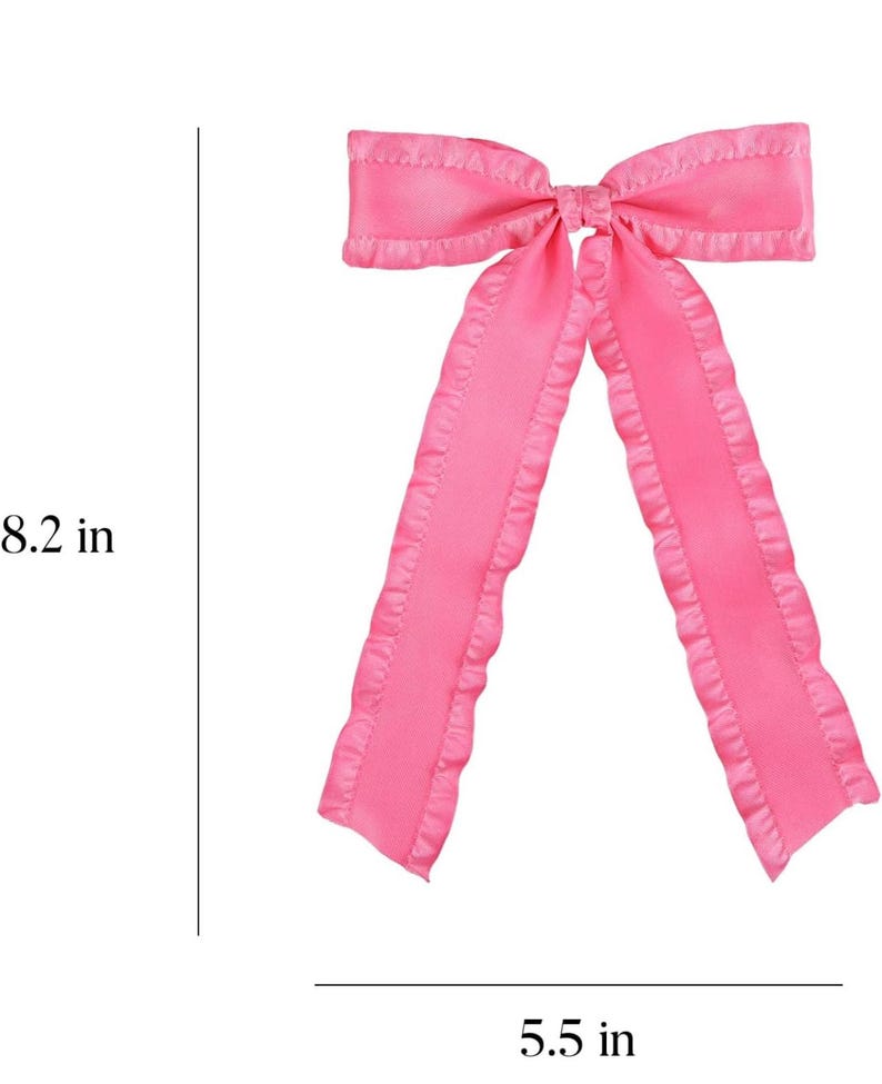 May include: A pink satin bow with ruffled edges. The bow measures 8.2 inches in length and 5.5 inches in width.