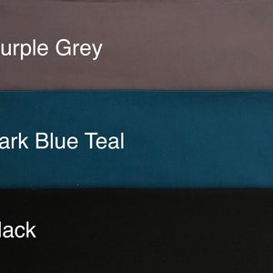 May include: Image showcasing three color swatches: Purple Grey, Dark Blue Teal, and Black. The text labels each color. The colors are solid and appear to be fabric or paint samples.