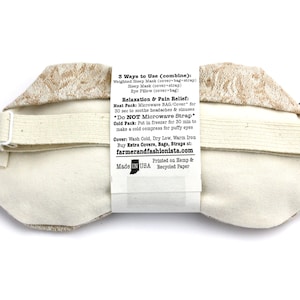 May include: A beige eye mask with a brown floral pattern. The back of the mask has instructions for using it as a heat or cold pack. The text reads: "3 Ways to Use (combine): Weighted Sleep Mask (cover-bag-strap) Sleep Mask (cover+strap) Eye Pillow (cover-bag) Relaxation & Pain Relief: Heat Pack: Microwave BAG/Cover for 30 sec to soothe headaches && sinuses *Do NOT Microwave Strap* Cold Pack: Put in freezer for 30 min to make a cold compress for puffy eyes Cover: Wash Cold, Dry Low, Warm Iron Buy Extra Covers, Bags, Straps at: farmerandfashionista.com Printed on Hemp & Made IN USA Recycled Paper"