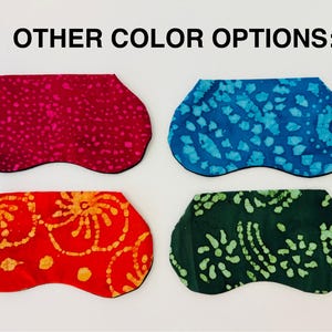 May include: Image shows four eye masks in various colors. The masks are in shades of red, blue, and green, each with a unique patterned design. The text "OTHER COLOR OPTIONS:" is at the top of the image.