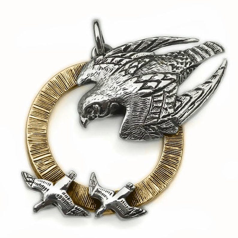 bird of prey animal totem jewelry as seen on TV. Peregrine Falcon necklace solid gold and silver raptor pendant