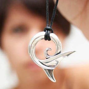 Shark necklace, silver shark tail pendant, shark jewelry, koru design. © Argent Aqua