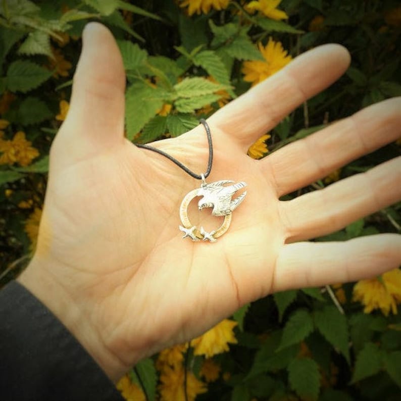 bird of prey animal totem jewelry as seen on TV. Peregrine Falcon necklace solid gold and silver raptor pendant
