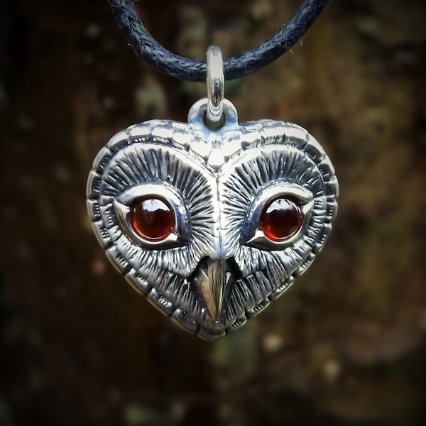 Owl necklace, January Birthstone garnet eyes, sterling silver, heart shaped owl head pendant. © Argent Aqua