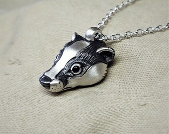 Small silver badger Necklace, badger head pendant, sterling silver and natural sapphire eyes, solid silver chain. © Argent Aqua