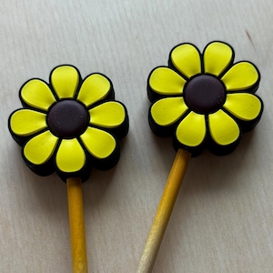 May include: Two yellow wooden pencils with yellow and brown flower toppers. The pencils are engraved with the text "Jimmy Dream" and "www.etsy.com/shop/JimmyDream".