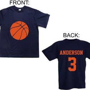 May include: A navy blue t-shirt with an orange basketball on the front and the name "Anderson" and the number "3" on the back.