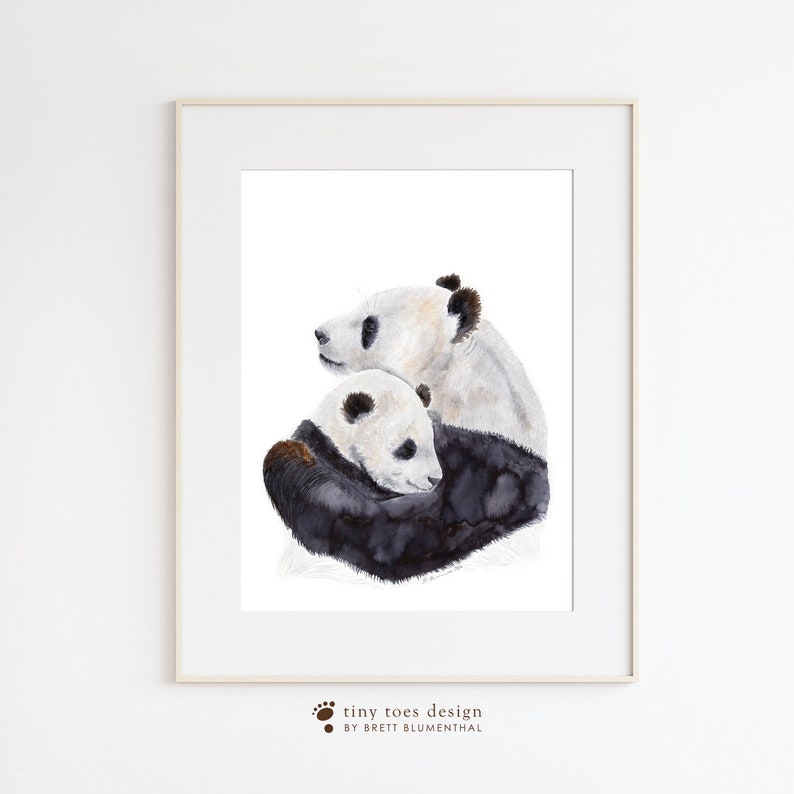 a picture of two panda bears in a frame