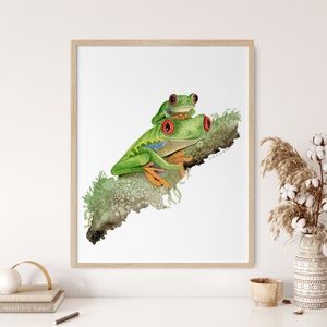 May include: Watercolor painting of two green tree frogs perched on a branch. The frogs have red eyes and are sitting on a branch with green leaves. The painting is on a white background.
