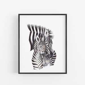 A framed print depicting two zebras, one adult and one foal, with their distinctive black and white striped patterns.