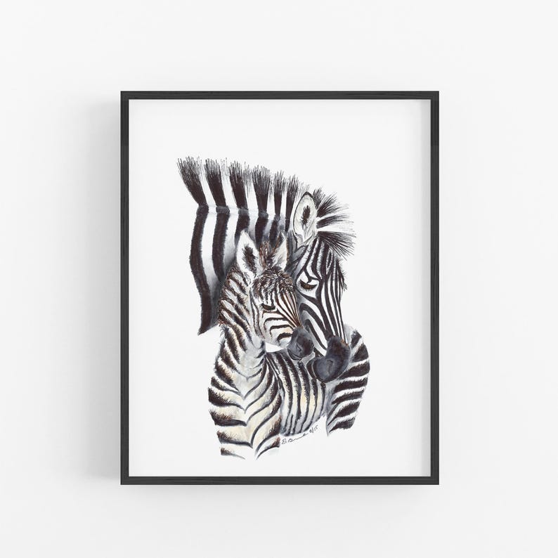 A framed print depicting two zebras, one adult and one foal, with their distinctive black and white striped patterns.