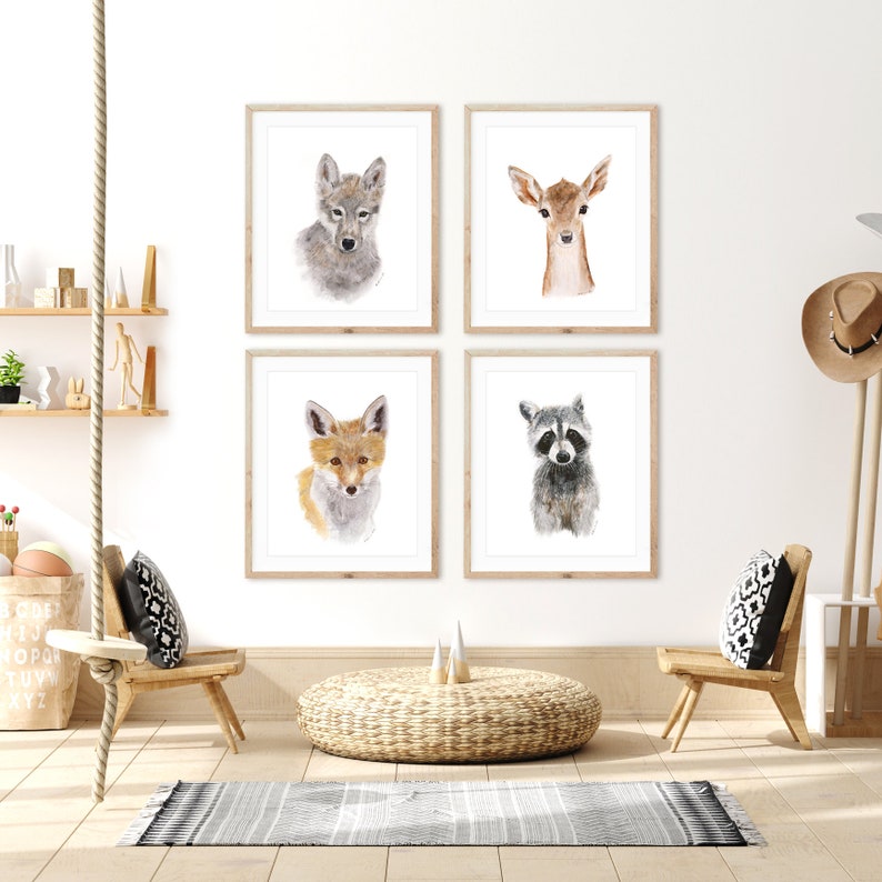 a living room with four pictures of animals on the wall