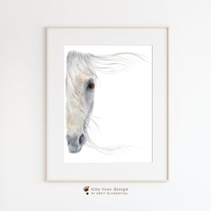 May include: A watercolour painting of a white horse's head with a brown eye, the horse's mane is blowing in the wind.