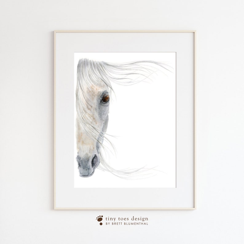 May include: A watercolour painting of a white horse's head with a brown eye, the horse's mane is blowing in the wind.