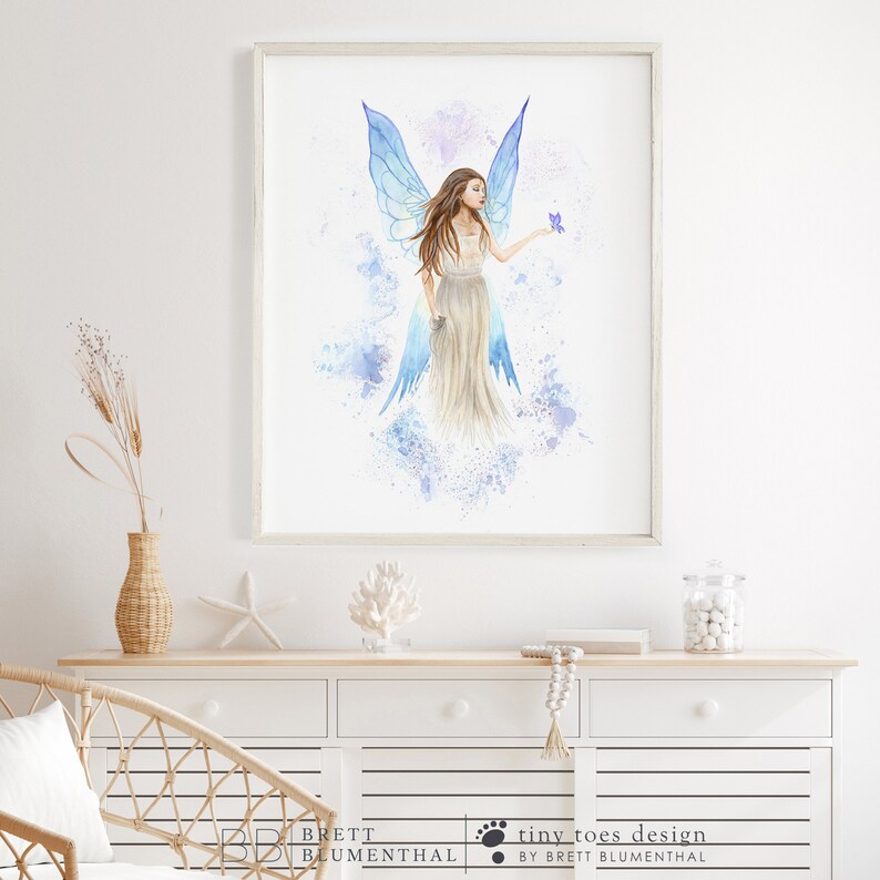 May include: A watercolor painting of a fairy with blue wings and a flowing white dress. The fairy is holding a small purple butterfly in her hand. The background is a light blue and purple watercolor wash.