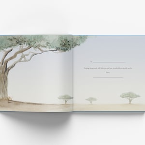 May include: An open book with a watercolor illustration of trees on the left page. The right page has a blank space for writing with the text "To:  Hoping these words will help you see how wonderful our world can be. Love, ".