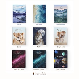 May include: Nine different watercolor journal covers with various themes. The covers feature images of a glacier, ocean, mountains, lions, wolves, elephants, a pink nebula, a blue nebula, and a solar system.