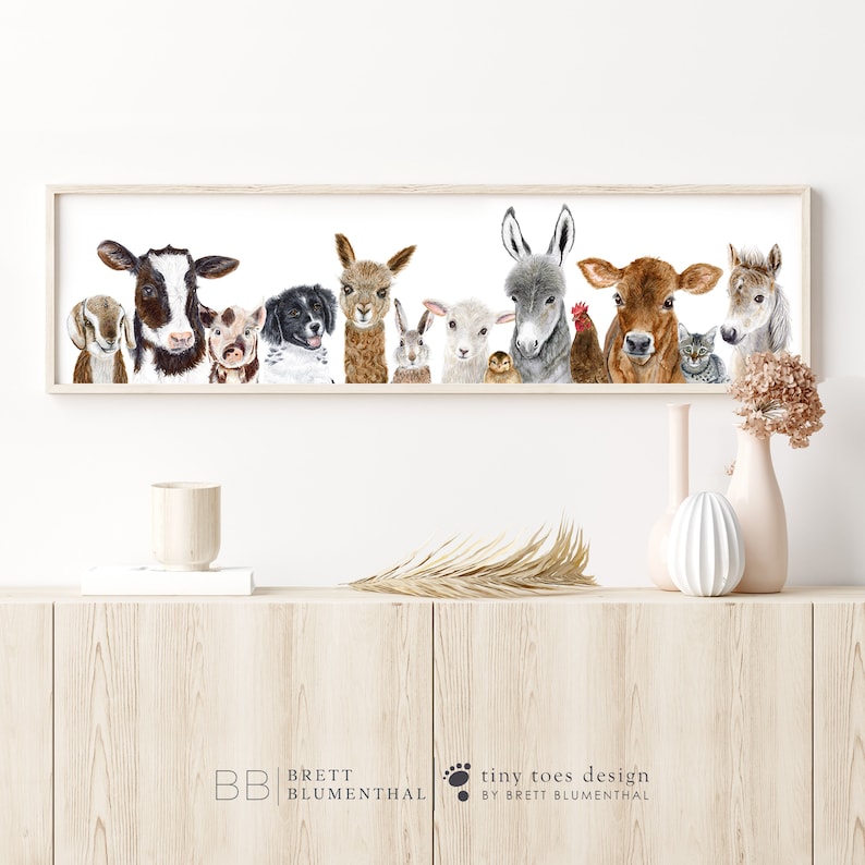 May include: A watercolor painting of a group of farm animals, including a cow, pig, dog, llama, rabbit, sheep, donkey, rooster, cat, and horse. The animals are all looking at the viewer with their heads tilted slightly. The painting is framed in a light wood frame.