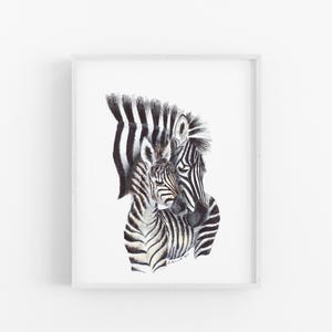 A framed print depicting two zebras, one adult and one foal, with their distinctive black and white striped patterns.