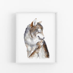 A framed watercolor painting depicting a mother wolf and her cub.