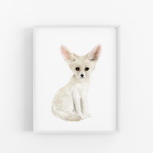 A white fox sitting on its hind legs with its front paws resting on its knees, looking directly at the camera.