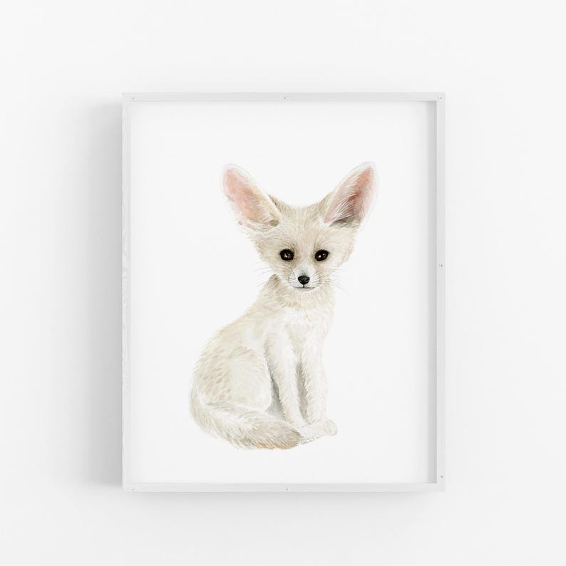 A white fox sitting on its hind legs with its front paws resting on its knees, looking directly at the camera.