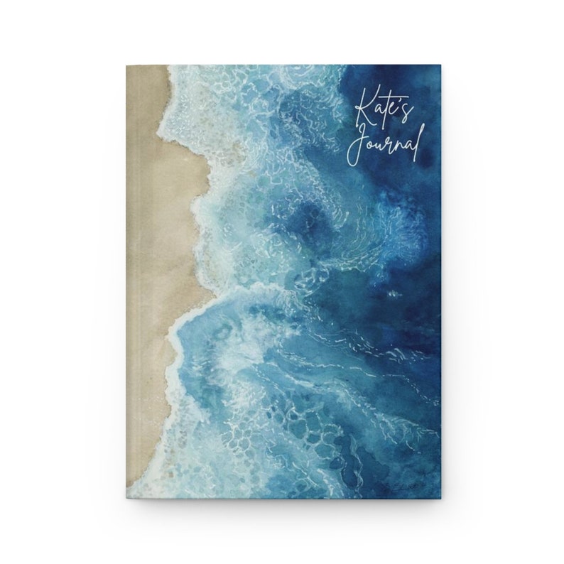 May include: A watercolor painting of ocean waves crashing on a sandy beach. The text "Kate's Journal" is written in white cursive on the top right corner of the image.