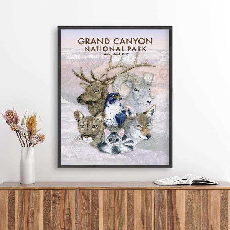 The image is a framed poster of various animals, including a deer, a bird, a wolf, and a cat, set against a pale pink background.