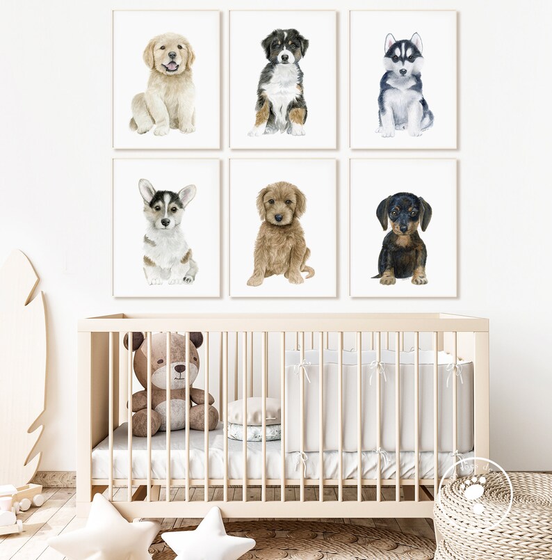 May include: Six watercolor paintings of different dog breeds, each framed in a white frame. The paintings are arranged in a grid of two rows and three columns. The dogs are all puppies and are sitting in a variety of poses. The paintings are all on a white background.