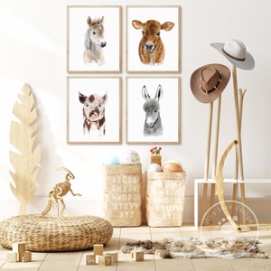 a set of four animal prints on a wall